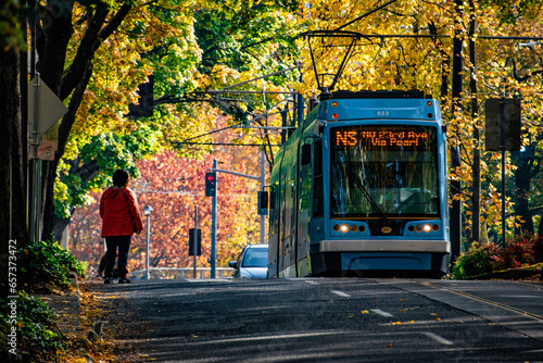 Downtown Portland, OR Shuttle Train Going Down Street With Fall Colors