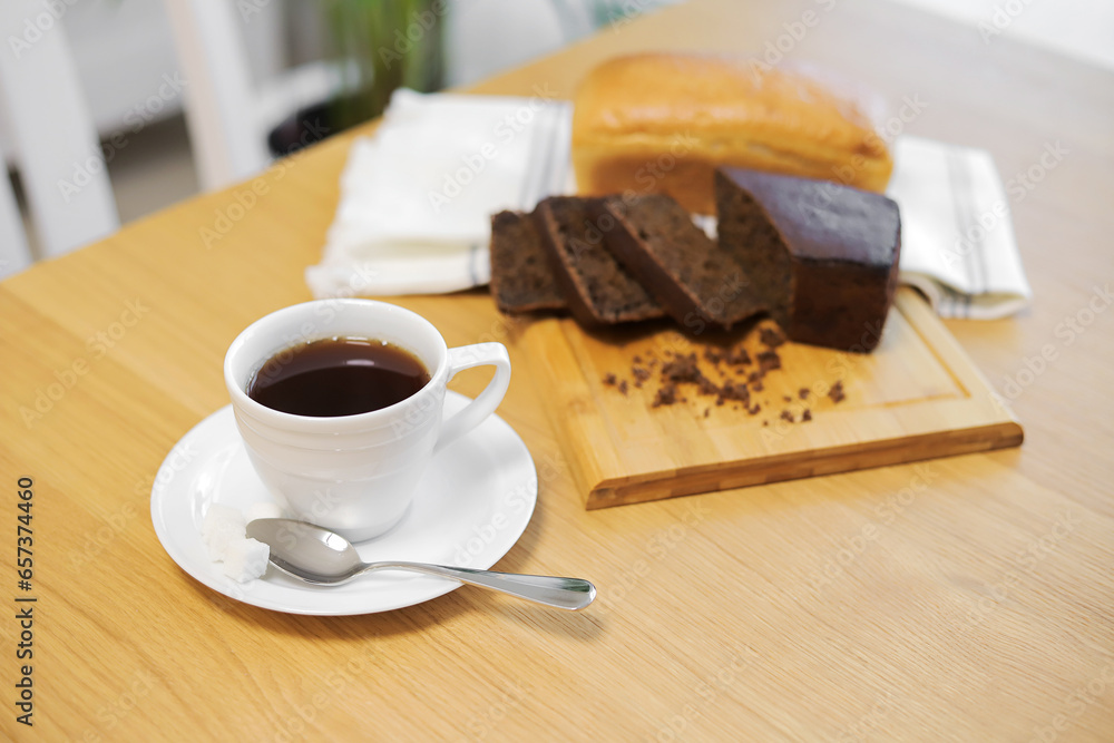 Coffee cup and bread on the table Coffee cup and bread on the table