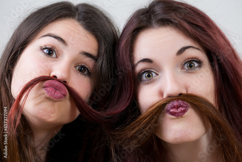 Quadro em tela Young women, with perfect makeup, make silly faces