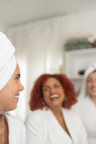 Women and worker in a beauty spa smiling and chatting