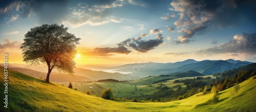 Scenic Carpathian nature mountains sunset dramatic sky above valley green fields and trees on hillside