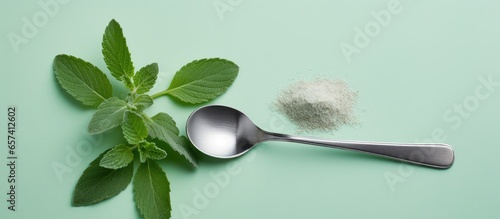Stevia powder in teaspoon viewed from above on a isolated pastel background Copy space photo