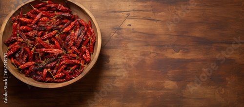 Red chillies dried in bowl isolated pastel background Copy space