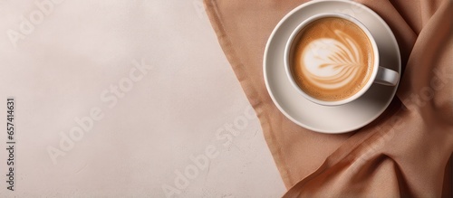 Spilled coffee on delicate cloth isolated pastel background Copy space