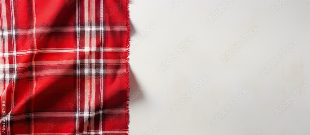 Obraz premium Top view of isolated pastel background Copy space with red and white scotch pattern fabric and available space for text Textured background concept