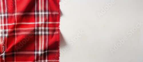 Top view of isolated pastel background Copy space with red and white scotch pattern fabric and available space for text Textured background concept