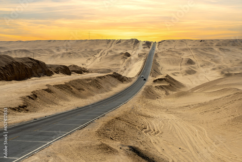 a long road in sand desert