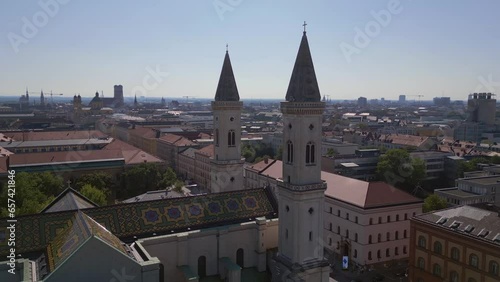 Lovely aerial top view flight 
Church clock St Ludwig City town Munich Germany Bavarian, summer sunny blue sky day 23. very close passing flight drone
4k cinematic footage photo