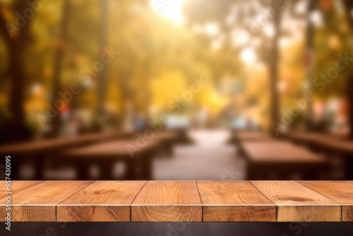The empty wooden table top with blur background. Exuberant image.