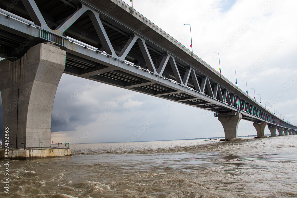 Most extensive Padma bridge photography under the dark cloudy sky