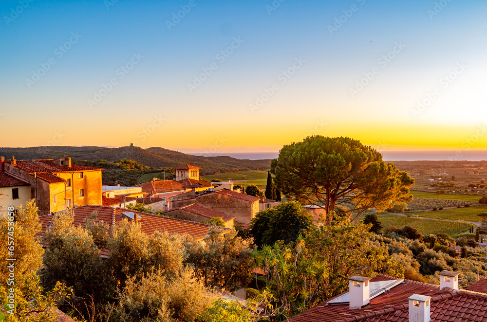 Panoramic view of the town profile of Castagneto Carducci Livorno Tuscany Italy from the surrounding countryside