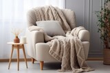 comfortable armchair with a cozy knitted blanket