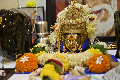Durga Goddess Head. Golden Sculpture Face. Hindu God. Navratri Worship. Mahakali. Maharashtra culture. Dussehra festival photo