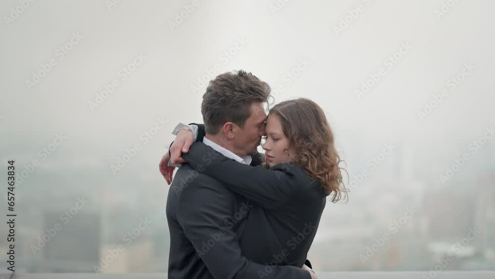 Young Couple On Roof Of Building. Young Couple On Roof Of Building.