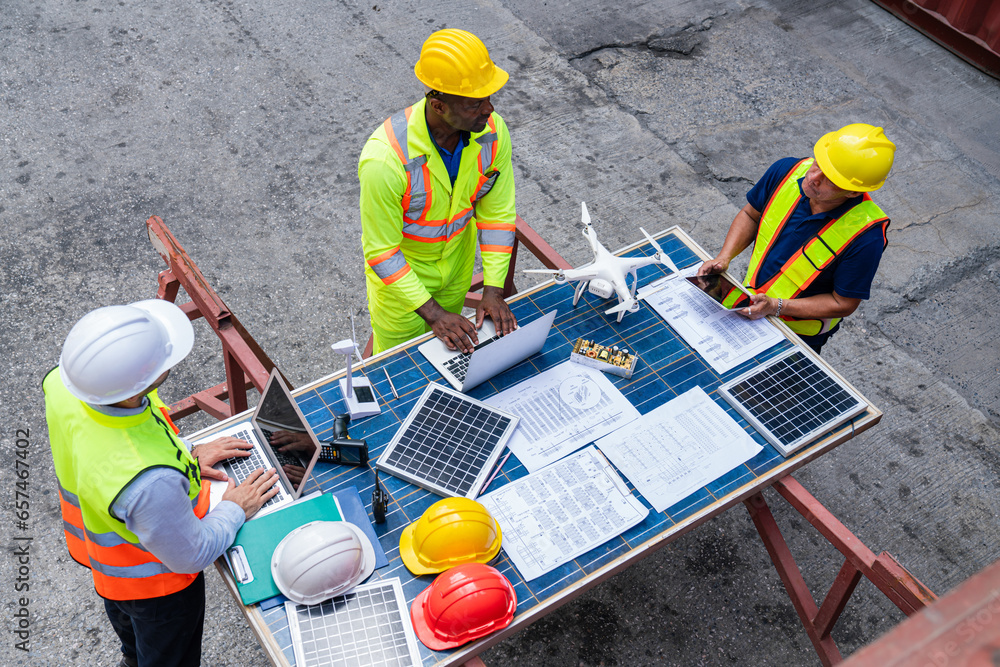 custom made wallpaper toronto digitalTop view of team engineer working on solar panel and his blueprints with Solar photovoltaic equipment on construction site. Success teamwork