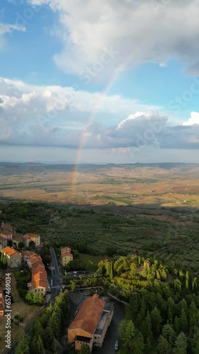 Aerial view of a rainbow in the sunset in Tuscany, Italy