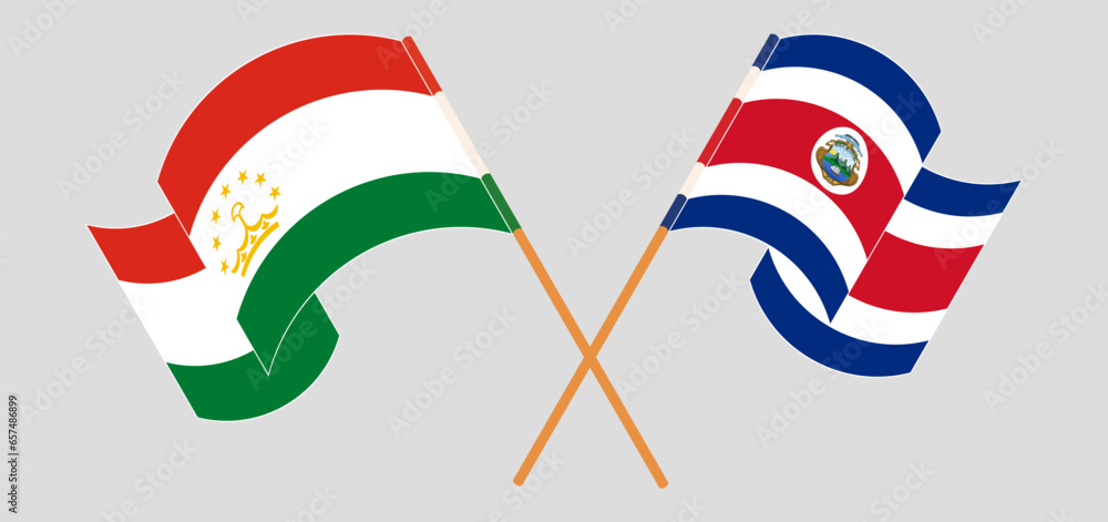 Crossed and waving flags of Tajikistan and Costa Rica