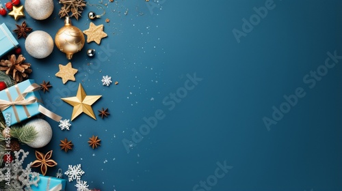 Merry Christmas and Happy Holidays greeting card, frame, banner. New Year. Noel. Christmas ornaments and gift on blue background top view. Winter xmas holiday theme. Flat lay with free space
