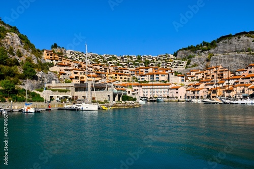 Tourist village at the coast of the Adriatic sea at Portopiccolo Sistiana in Duino-Aurisina near Trieste, Italy photo