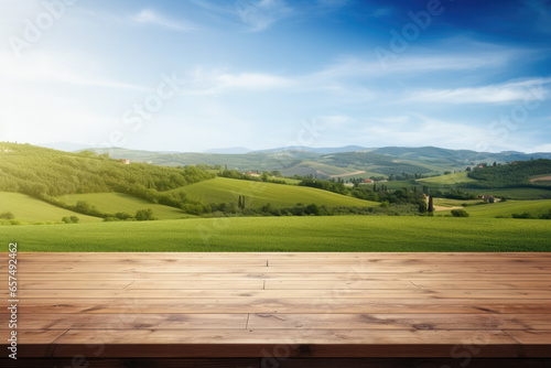 Empty wooden table with green fields background. Table top product display showcase stage. Image ready for montage your text or product. 
