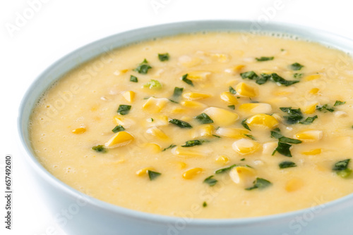 Corn soup in white bowl isolated on white background. Close up