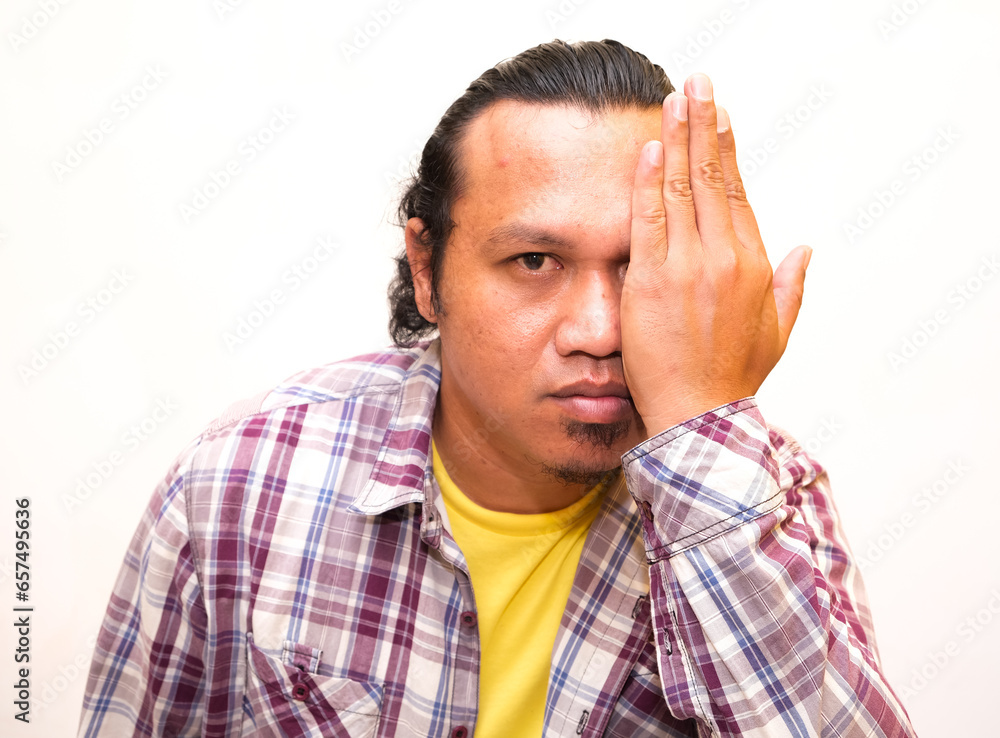 gesture of asian man closing one eye isolated white background gesture of asian man closing one eye isolated white background