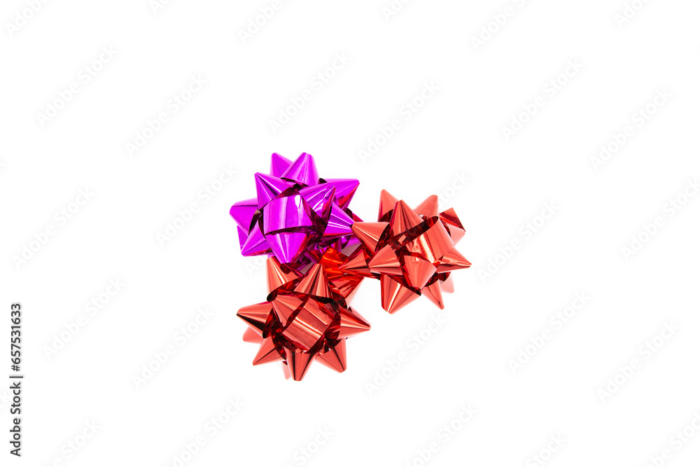 Red and pink bows isolated on white background. Top view of gift bows. Red and pink bows isolated on white background. Top view of gift bows.