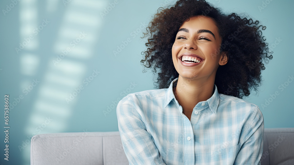 portrait of a young smiling woman on a blue pastel background portrait of a young smiling woman on a blue pastel background