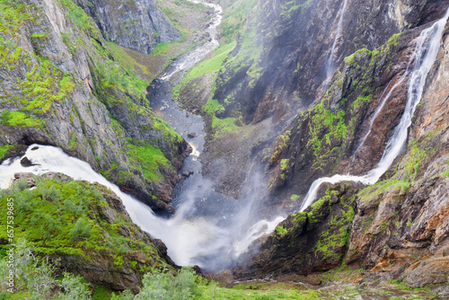 Voringsfossen waterfall at the top of the Mabodalen valley in the municipality of Eidfjord, Norway photo