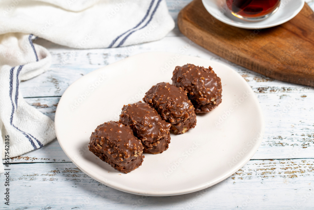 Chocolate cookie. Delicious cookies with chocolate and hazelnuts on a plate. Close up Chocolate cookie. Delicious cookies with chocolate and hazelnuts on a plate. Close up