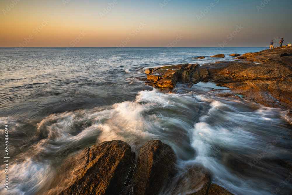 Sunset at a rocky shore in New England