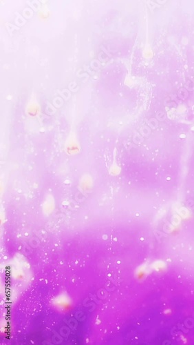 Pink particles floating vertical video photo