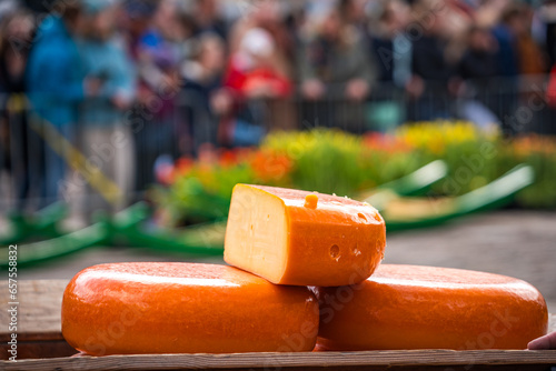 dutch cheese on a wooden table at alkmaar cheese market photo