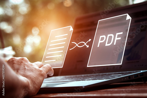 Convert PDF files with online programs. Users convert document files on a platform using an internet connection at desks. concept of technology transforms documents into portable document formats. photo