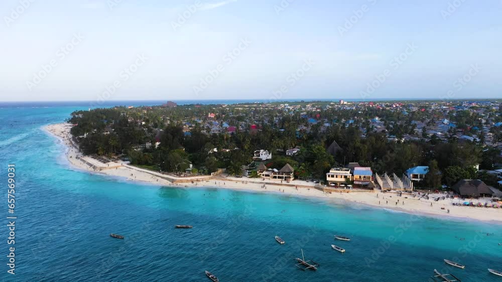Beaches and islands of the Indian Ocean. Drone view of a tropical island and corral reef in the Indian Ocean. The concept of a paradise vacation. Sea coast with white sand. Beaches and islands of the Indian Ocean. Drone view of a tropical island and corral reef in the Indian Ocean. The concept of a paradise vacation. Sea coast with white sand.