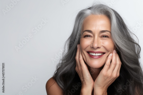 Portrait of a beautiful ageing mature black woman with long grey hair. Healthy face and skin care beauty, cosmetics, cosmetology concept.