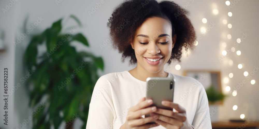 Young african american woman ordering gift during Christmas holiday at home using smartphone and credit card. Shopping online during holidays, internet banking, store online. Young african american woman ordering gift during Christmas holiday at home using smartphone and credit card. Shopping online during holidays, internet banking, store online.