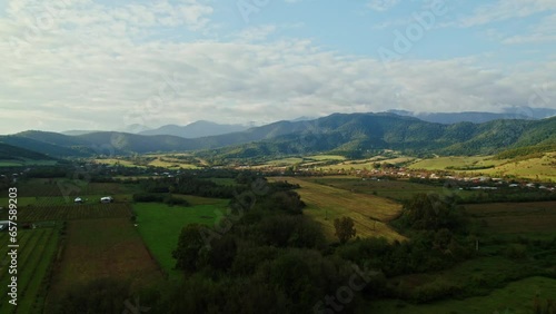 Flying over a forest in Georgia.Amazing scenery. Fields and mountains photo