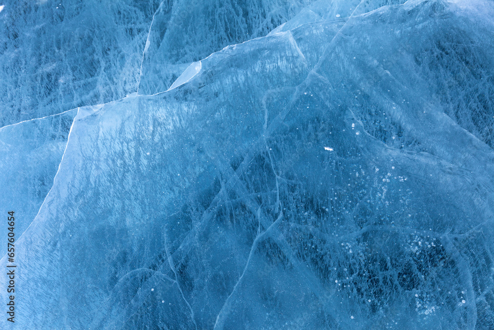 Winter natural ice background of frozen Baikal Lake in cold February