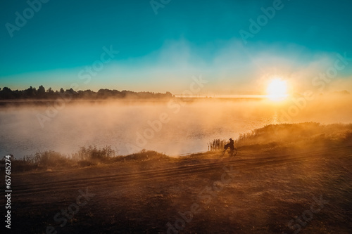 Beautiful landscape with fog on lake in autumn morning