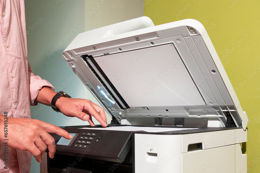 office worker and his cats printing paper on a multifunction laser printer in home office documents or paperwork. Secretary work. office worker and his cats printing paper on a multifunction laser printer in home office documents or paperwork. Secretary work.