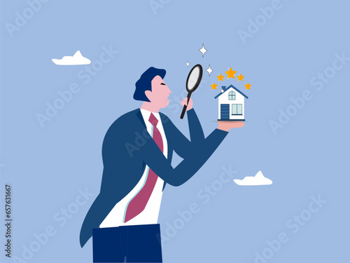 businessman appraiser magnifier review property with star rating.Property appraisal or price evaluation, housing assessment for market value, residential sale, rating or real estate review concept.