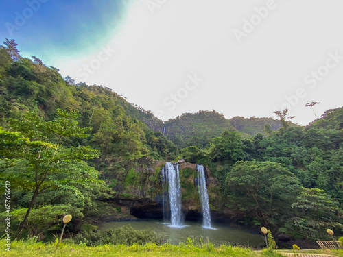  Sodong Waterfall located in Ciwaru Village, Ciemas District, Sukabumi Regency. One of several waterfalls which is a mainstay destination in the Ciletuh Unesco Unesco Global Geopark (CPUGGp). photo