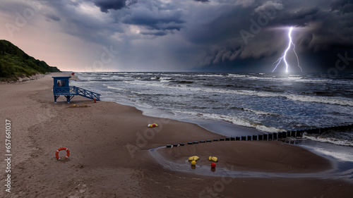 Lifeguard tower flooded byt Baltic Sea during lightning storm. photo