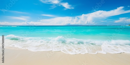Beautiful beach with white sand, turquoise ocean water and blue sky with clouds in sunny day. Panoramic view. Natural background for summer vacation