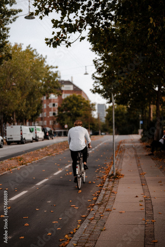 Photography A man riding a bike to work, Copenhagen, Denmark