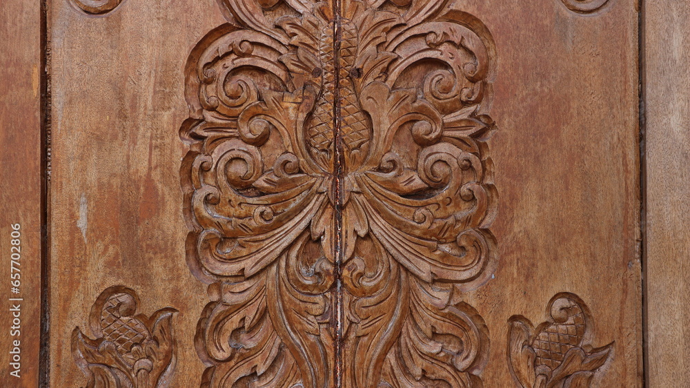 carved wooden doors on Javanese houses