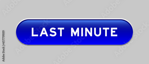 Blue color capsule shape button with word last minute on gray background