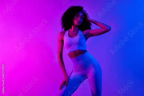 Portrait of nice sportive person posing advertising sportswear cloth line isolated on gradient color neon background