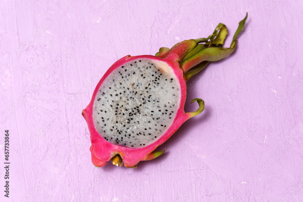 Organic dragon fruit on a pink background, creative summer food concept Organic dragon fruit on a pink background, creative summer food concept